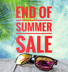 End of summer sale banner with sunglasses over blurred tropical tree background, summer promotion poster background idea
