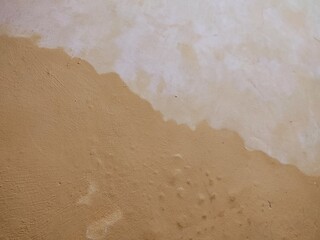 texture, pattern, rough and uneven yellow wall background, creating a lively and abstract background.