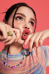 Young woman with playful expression in colorful attire.