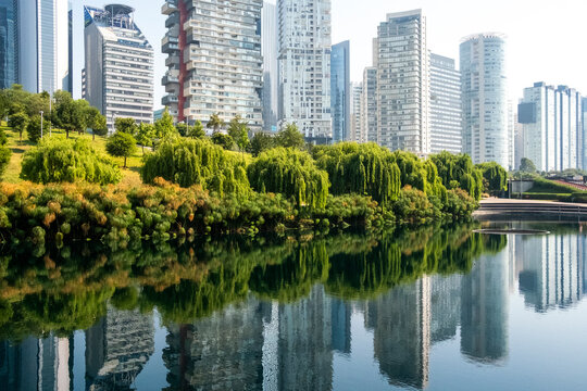 Reflections of Santa Fe skyline on water from Parque La Mexicana, Mexico City, clean modern architecture background and real estate scene