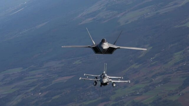 F-22 and F-16 Fighting Falcon Fighter Jet flying in the sky
