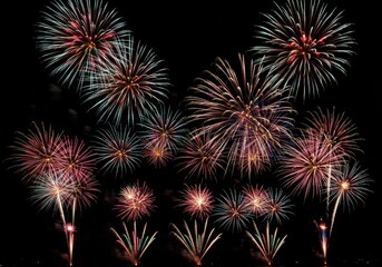 Spectacular nighttime fireworks display over dark sky