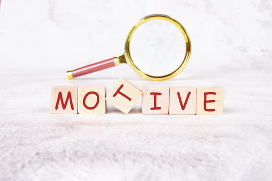 The concept word MOTIVE is assembled from wooden cubes. business motivational concept - Powered by Adobe