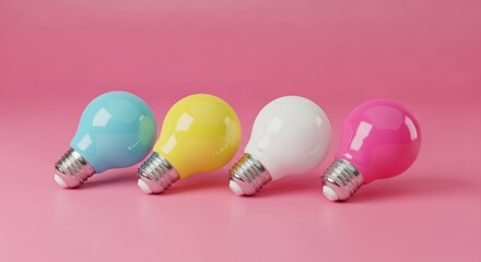 Four colorful light bulbs in a row on a pink background creating a vibrant and playful composition