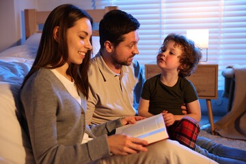 Happy family reading bedtime story at home