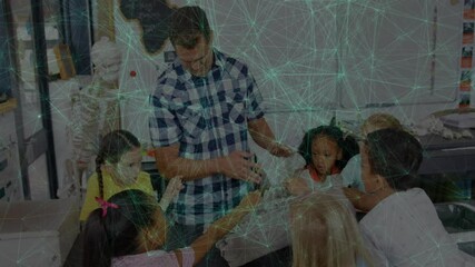 Teacher entering lab showing plastic bone to students with motion overlay mapping it onto skeleton - Powered by Adobe