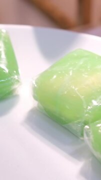 traditional food tape uli and black sticky rice, Indonesian Sweet and savory dessert, Tape is made of fermented black glutinous rice, Ketan Uli is made of steam glutinous rice cake wrapped 