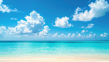 Fototapeta premium Crystal-clear turquoise waters gently touch the soft sandy shore under a bright blue sky filled with fluffy white clouds, creating a perfect tropical paradise scene.