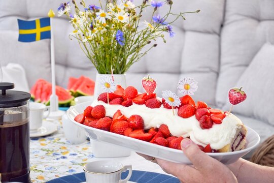 Strawberry cake decorated in honor of midsummer.