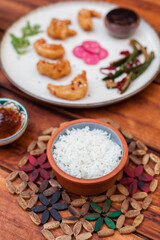Classic steamed white rice served as a side in Vietnamese cuisine. Simple top-down food shots with rice in bowls and plates