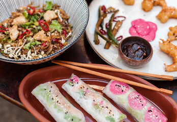Authentic Vietnamese cuisine including pho bo, spring rolls with shrimp and noodles, fried shrimp, chicken noodles, rice, and pickled vegetables. Flat lays and styled food shots