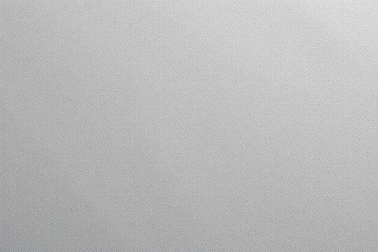 Textured gray surface with subtle grainy pattern and diffused lighting