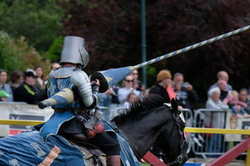 Knght Jousting Tournament. Knight in medieval armour on a horse. 