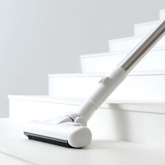 A white vacuum cleaner cleaning white stairs in a minimalist and clean environment setting indoors