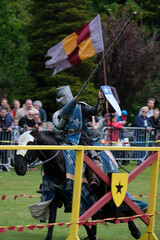 Knght Jousting Tournament. Knight in medieval armour on a horse. 
