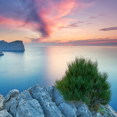 awesome Sunset Casting Warm Light Over Majestic Mediterranean Cliffs and Verdant Greenery