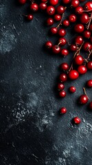 wild berries scattered on dark kitchen counter.