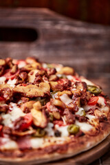 Gyros Pizza with jalapeno pepper, cherry tomatoes and mozzarella cheese. Soft focus. Close up.	