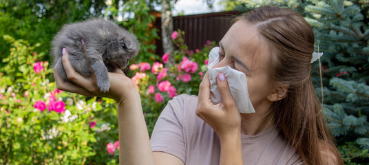 Woman Sneezing from Cat Allergy in Garden