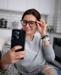 Happy Girl Taking A Selfie With A Smartphone Or Having An Online Video Chat