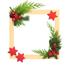 Christmas red star ball shape tree decorations, holly, winter flora on gold border on white background. Festive frame design for Xmas holiday season.