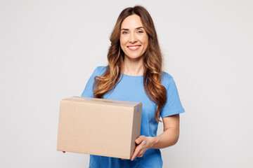 Young smiling happy cheerful Caucasian woman wears blue t-shirt casual clothes hold blank cardboard...