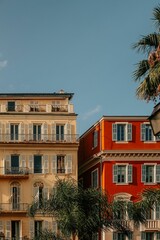 Naklejka premium Colorful European buildings with palm trees.