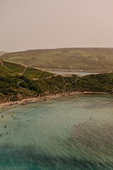 Aerial view of a serene beach with turquoise waters.
