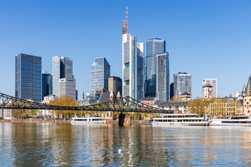 Frankfurt skyline skyscrapers with banks on River Main with excursion boats in Frankfurt, Germany