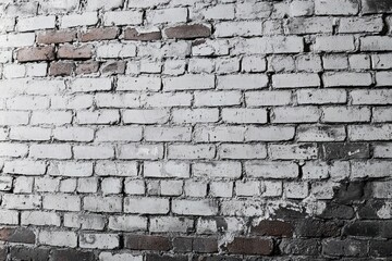 Old brick wall with white paint and red bricks. AI generative