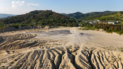Buzău's Boiling Mud Volcanoes. 
This photo provides a glimpse into this extraordinary geological phenomenon, where the Earth seems to be constantly in motion.