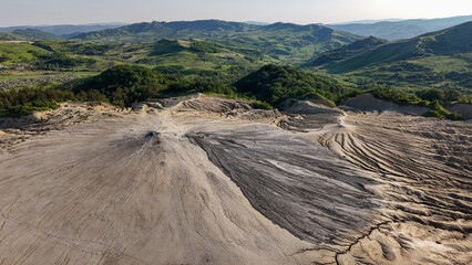 Buzău's Boiling Mud Volcanoes. 
This photo provides a glimpse into this extraordinary geological phenomenon, where the Earth seems to be constantly in motion.