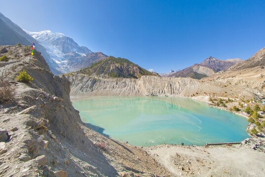 Himalayas, Nepal - The famous hiking on the roof of the world called Annapurna Circuit in Himalaya range mountain, with little village, buddhist stupa and mountains of 8000 meters.
