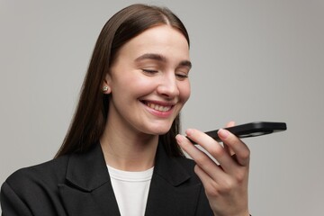Joyful Woman Engaging With a Smartphone, Showcasing Modern Communication and Connection Within a...