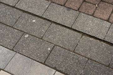 Diagonal view of brick paving creating a geometric surface pattern. Concept of texture and urban...