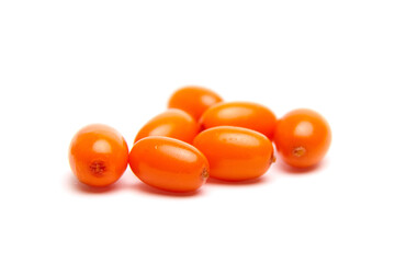 A small group of bright orange sea buckthorn berries with a smooth, glossy surface, isolated on a white background. Rich in antioxidants and used in health foods