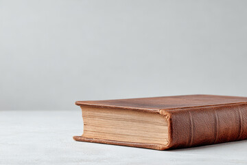 minimalistic of old leather book positioned on right edge of frame