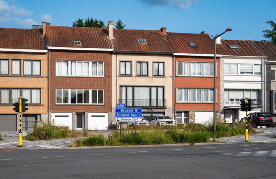 Houses in a row on a traffic intersection of national road N 202 in Strombeek Bever, Flemish Brabant Region, Belgium