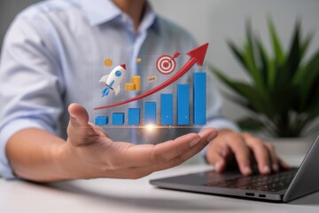 Holographic business growth chart displayed in a hand.