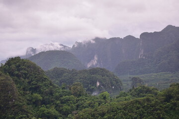 Obraz premium cloudy calcareous mountains, Green mountains and clouds, mist clouds after rain