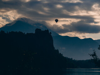 hot air balloon at sunrise in the mountains