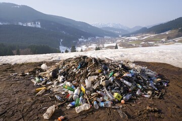 An environmental issue. A large pile of garbage polluting a beautiful landscape.