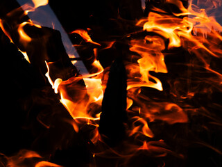 a campfire burning at night