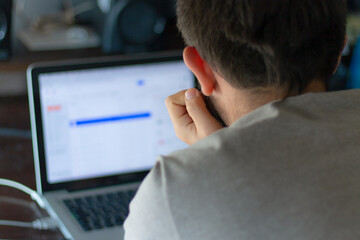 Back View of Person Working on Laptop