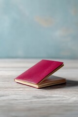Open passport on a desk beside investment book, Financial independence