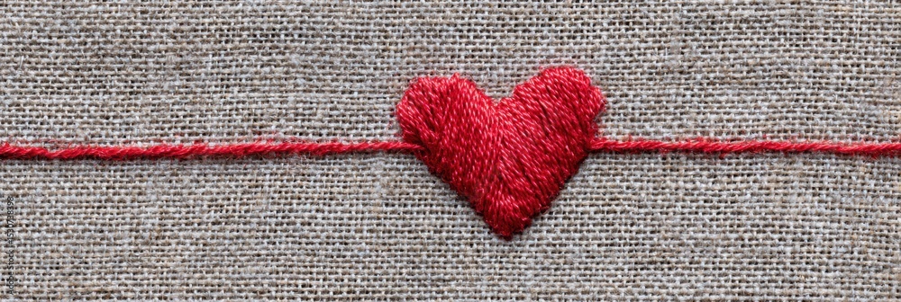 Poster Red Thread Intricately Stitched Into the Shape of a Heart on a Textured Linen Background Showcasing Craftsmanship and Creativity