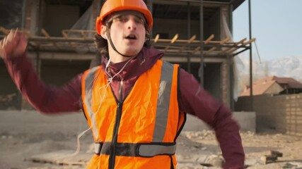 In front of a house under construction, a worker in a hard hat and vest spins and moves to the beat in his earbuds. His wild, fearless motions release a powerful surge, driven by the rhythm force.