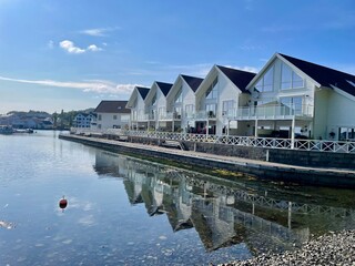 White boat houses by the harbor coastline  Norway 