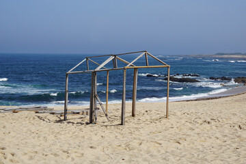 Wooden Structure on Sandy Beach