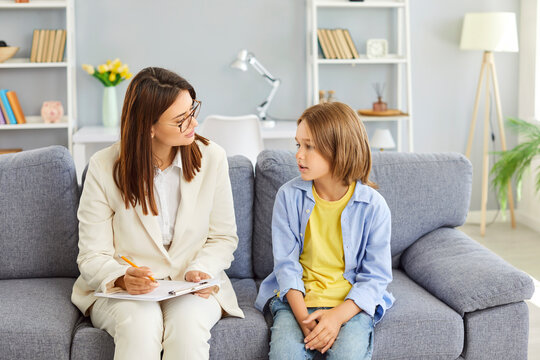 Fototapeta Child psychologist professional comforting asking teen boy, speaking, giving sympathy, advice, giving health, academics, social support, teenager and mentor teacher worker kind personal talk